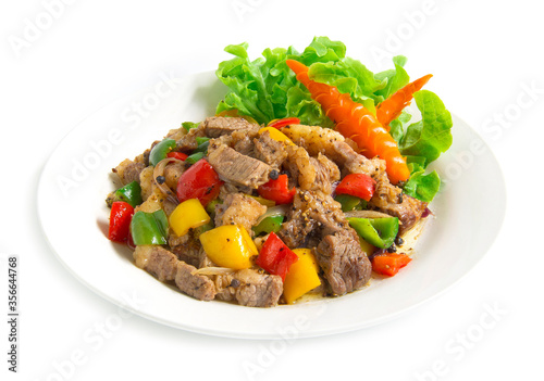 Stir Fried Beef with Black pepper and bell peppers,oyster sauce spicy food decorate with carved vegetables,chili style side view isolated on white background