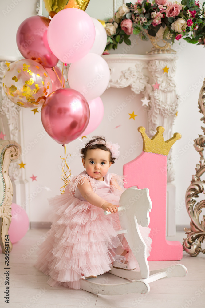 Fototapeta premium Baby girl at pink dress