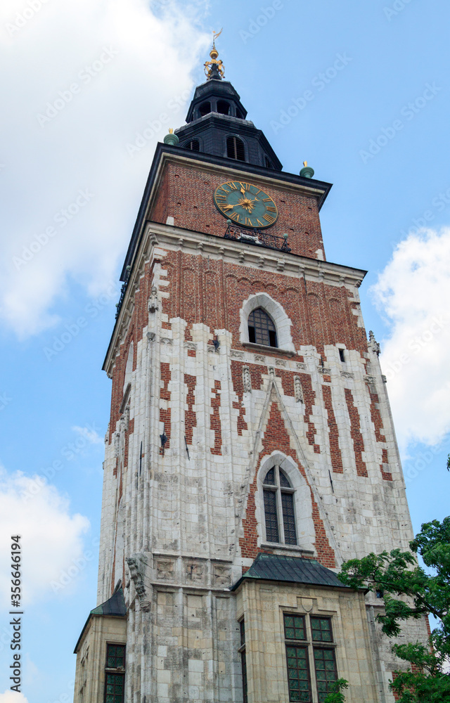 Gothic Town Hall Tower with clock at Market Square in old town of Krakow, Poland