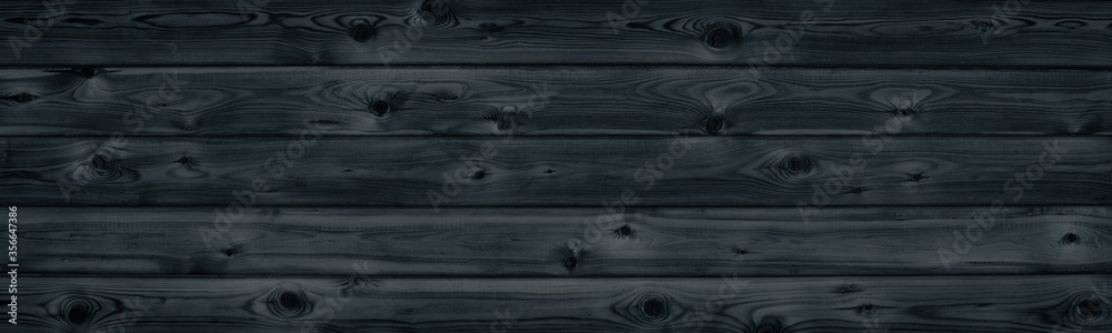 Black wooden board texture wide panorama. Wood pattern long surface. Dark retro background