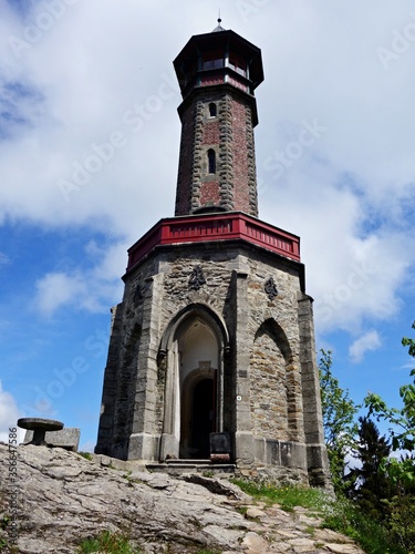 Stone neo-Gothic lookout tower   t  p  nka on the hill Hv  zda  959 m above sea level  on the P    chovice ridge - the oldest lookout tower in the Jizera Mountains.