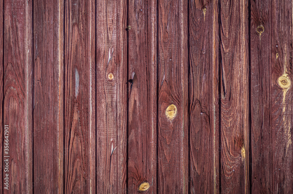 Wooden surface background vertical ragged brown painted board