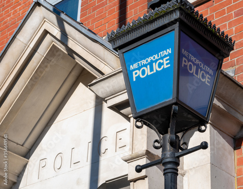 The Metropolitan Police sign by a police station in London. photo