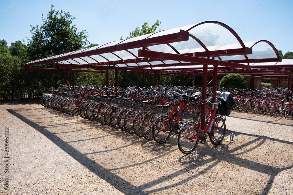 Hundreds of red bicycles in the bicycle shed Hundreds of red bicycles in the bicycle shed