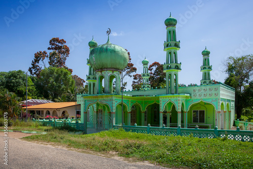 NIEUW AMSTERDAM. SURINAME - OCTOBER 5, 2018: Green mosque in the countryside of Suriname