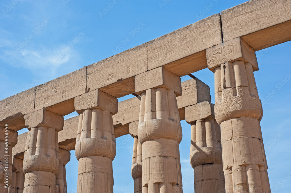 Hieroglyphic carvings on ancient egyptian temple columns Hieroglyphic carvings on ancient egyptian temple columns