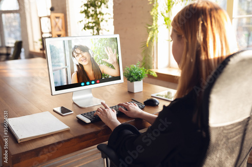 Businesswoman participate video conference looking at laptop screen during virtual meeting, videocall webcam app for business, close up. Remote working, freelance, education, lifestyle concept.