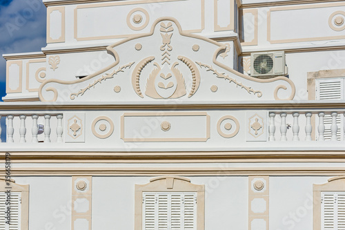 Traditional wall and pediment decorated with geometric patterns in Olhao, Algarve 