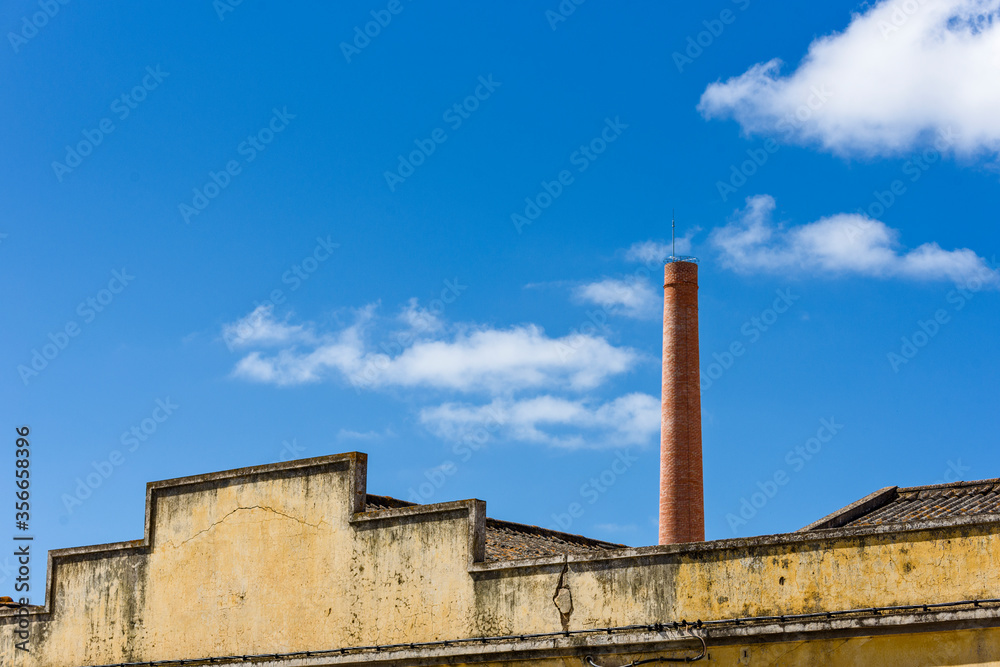 chimney of an old factory in Olhao, Algarve, Portugal