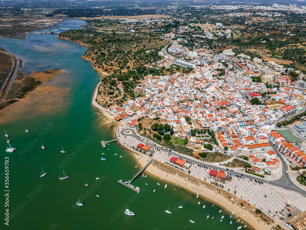 Naklejka premium Aerial view of nature and city of Alvor, Algarve, Portugal