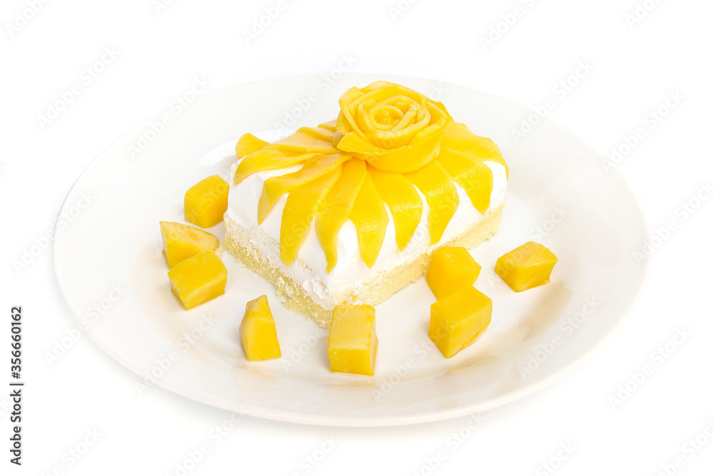 Milk Cake and cream with Mango flower shape carved style the best dessert or bakery popular on summer in Thailad side view isolated on white background Milk Cake and cream with Mango flower shape carved style the best dessert or bakery popular on summer in Thailad side view isolated on white background