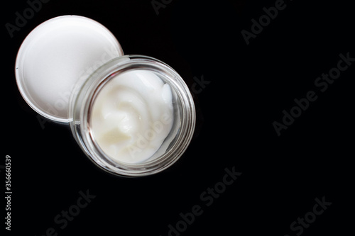 Cosmetics cream on black background.Copy space. Face creame
