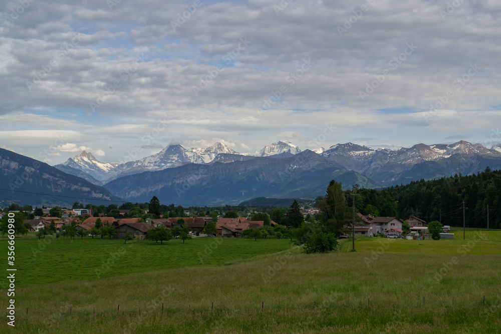 view of alpine mountains and village in Switzerland
