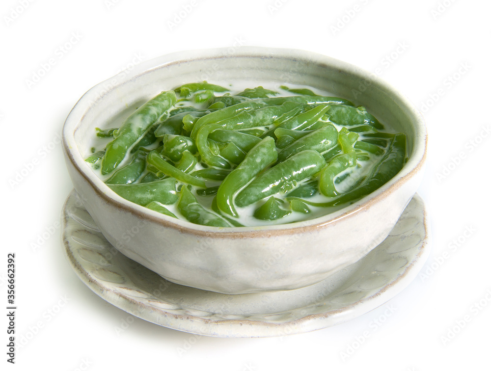 Thai dessert,Lod Chong Recipe Pandan Flavored Rice Flour Droplets in Sweetened Coconut Cream Syrup isolated on white background Thai dessert,Lod Chong Recipe Pandan Flavored Rice Flour Droplets in Sweetened Coconut Cream Syrup isolated on white background