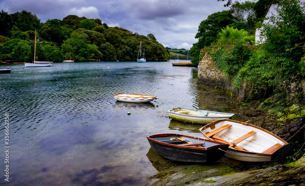Row boats in a Cornish Creek