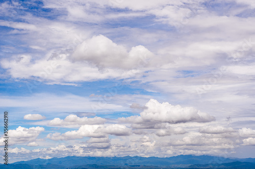 blue sky and clouds float below.