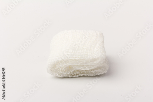 White gauze pads on white background. Materials for dental surgery. Close up