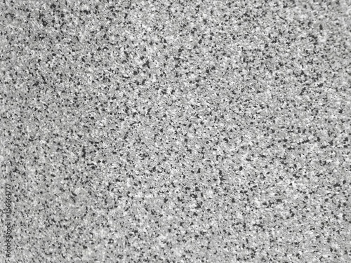 The pigment of the plastic spreads into small dots.abstract background.The surface is rough.monochrome color.