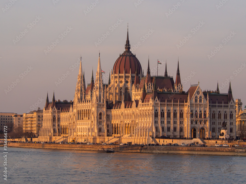 Budapest parliament building at danube river at sunset in spring 