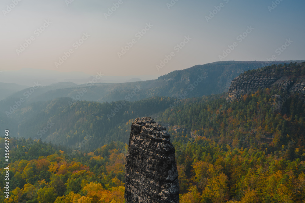 Beautiful Hilly Landscape with Mountains and Forest in Autumn Colors | Bohemian Switzerland National Park, Czechia Beautiful Hilly Landscape with Mountains and Forest in Autumn Colors | Bohemian Switzerland National Park, Czechia
