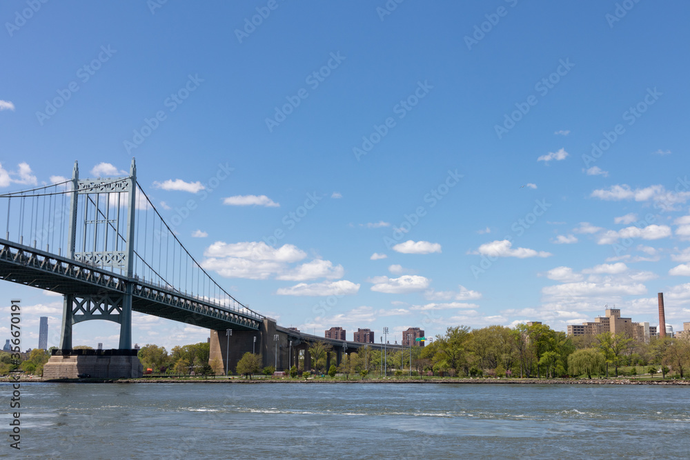 Fototapeta premium The Triborough Bridge connecting Astoria Queens New York to Wards and Randall's Island over the East River during Spring