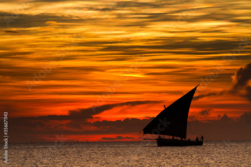 Dhow sailing during sunset in Zanzibar.
