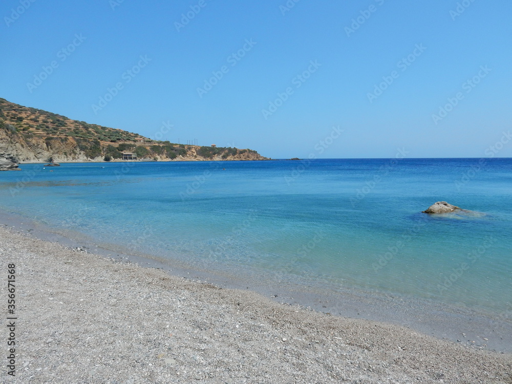 the tranquility and the crystal water of the paradisiac beach in Agios Nikolaos, Spoa, Karpathos, Greece
