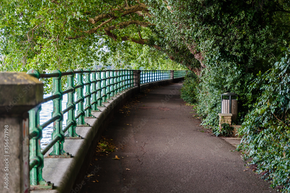 London, England, UK - August 22, 2017: The riverbank at Putney looking towards Fulham Palace
London, England, UK - August 22, 2017: The riverbank at Putney looking towards Fulham Palace
