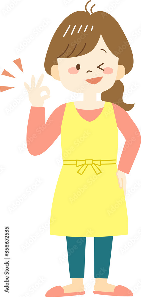 Young woman in yellow apron showing okay sign with hand Young woman in yellow apron showing okay sign with hand