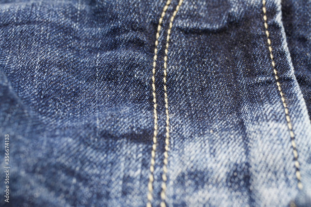Macro close up of isolated blue casual denim jeans pants zipper compartment with yellow stitches (focus on centre) Macro close up of isolated blue casual denim jeans pants zipper compartment with yellow stitches (focus on centre)