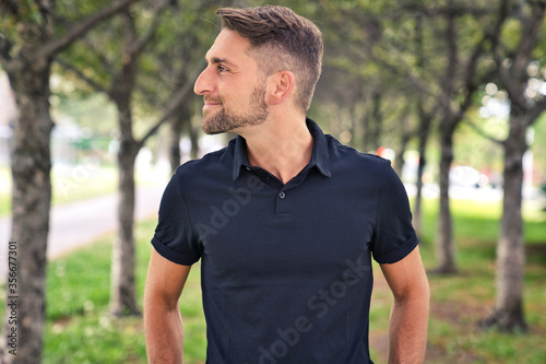 Portrait of a trendy young man on a sunny day in the city