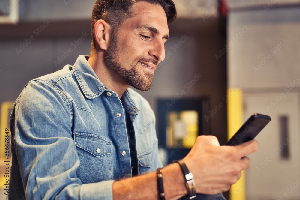 man on the basement background in the city using cellphone man on the basement background in the city using cellphone
