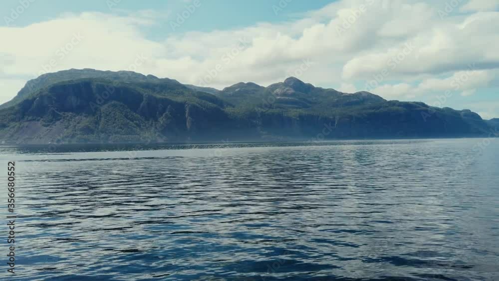 Scenery view of Lysefjord with fishing boat in the summer of Norway Scenery view of Lysefjord with fishing boat in the summer of Norway