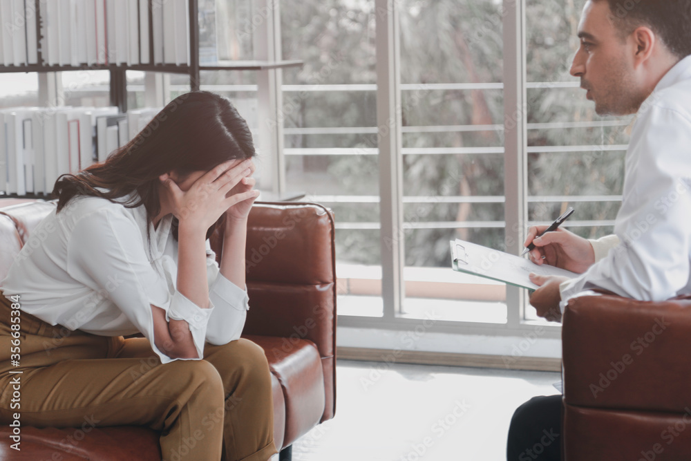 Depressed patient having consultation with psychiatrist doctor, woman getting upset, feeling stressed and sad, need help from psychologist, mental health concept Depressed patient having consultation with psychiatrist doctor, woman getting upset, feeling stressed and sad, need help from psychologist, mental health concept