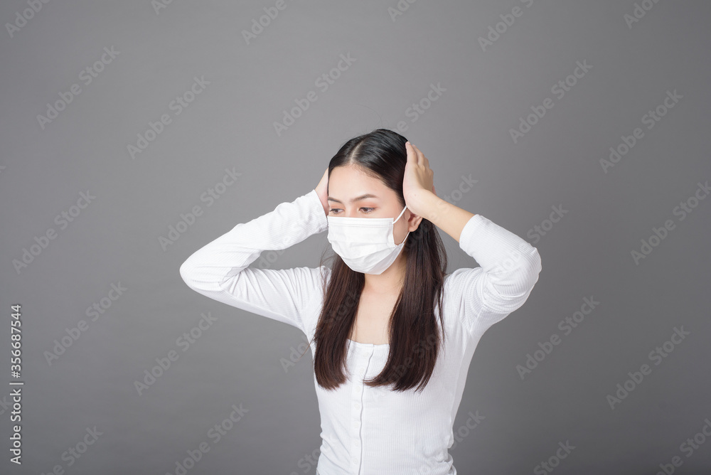 Portrait of woman with surgical mask in studio, Health care concept Portrait of woman with surgical mask in studio, Health care concept