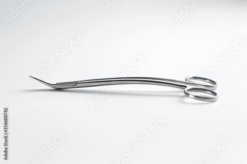 durable metal surgical scissors for suturing black on a white background