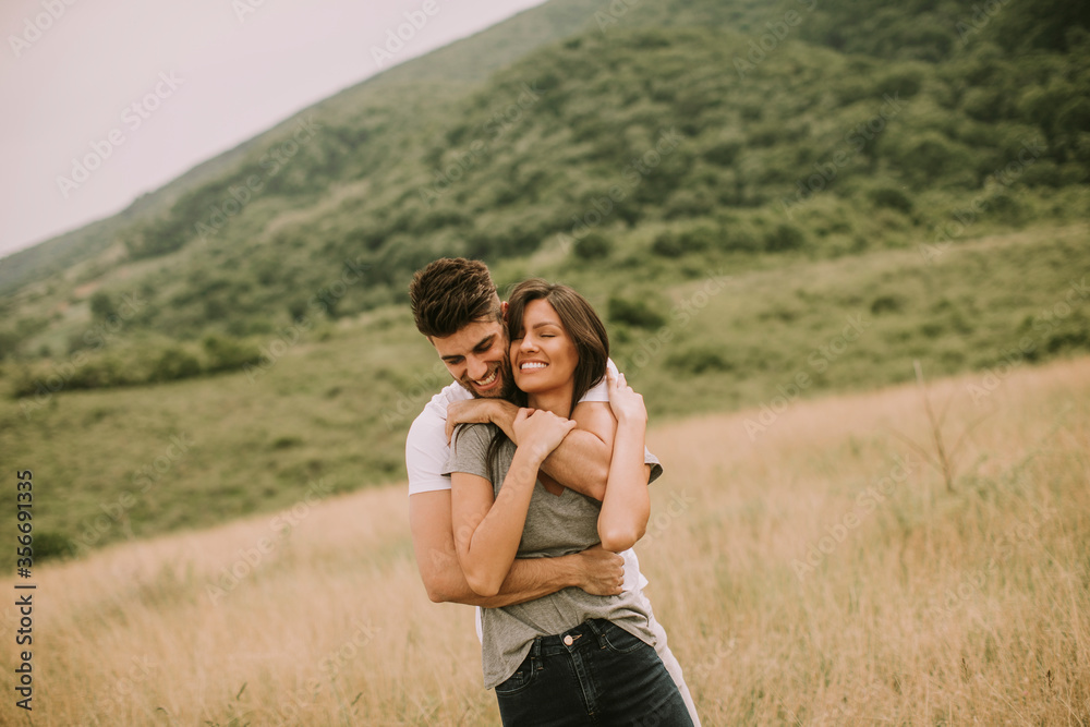 Pretty young couple in love outside in spring nature Pretty young couple in love outside in spring nature