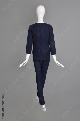 lifeless mannequin with blue clothes isolated grey background studio