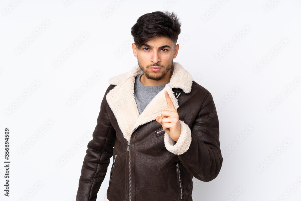 Arabian handsome man over isolated background frustrated and pointing to the front Arabian handsome man over isolated background frustrated and pointing to the front