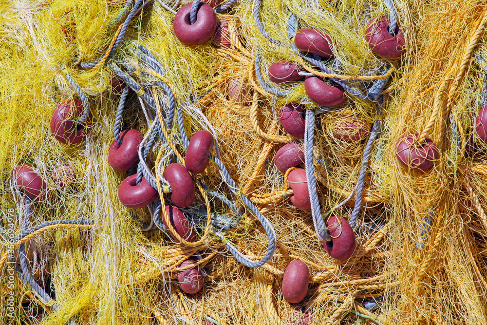 colourful fishing nets with floats and ropes colourful fishing nets with floats and ropes