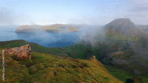 Time lapse clip. Incredible morning view of popular tourist destination - Sornfelli. Stunning summer scene of Streymoy island, Faroe Islands, Denmark, Europe. Full HD video (High Definition).
 photo