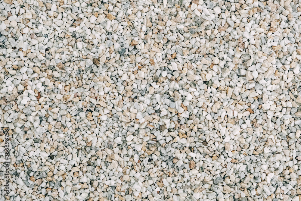 Texture of decorative stones or gravel as a background image. Top view. Copy, empty space for text Texture of decorative stones or gravel as a background image. Top view. Copy, empty space for text