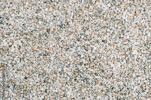 Texture of decorative stones or gravel as a background image. Top view. Copy, empty space for text