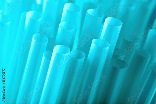 Blue plastic drinking straws. Macro close up view for background use