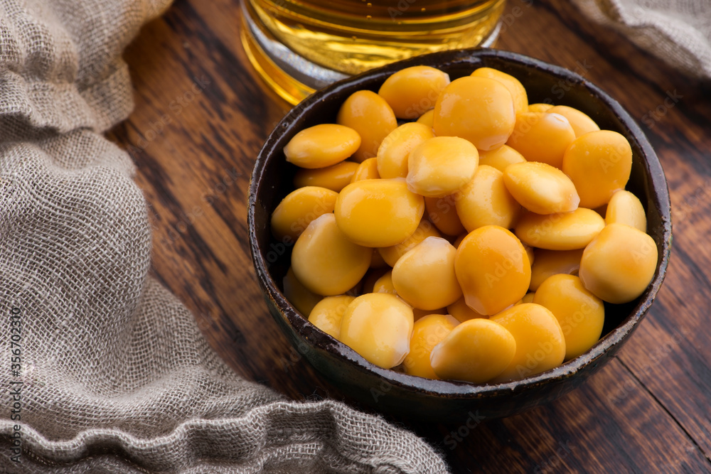 Tasty lupins and glass of beer. Beverage, legume. Tasty lupins and glass of beer. Beverage, legume.