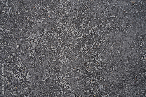 Fragment of road with asphalt surface.
