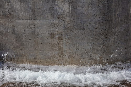 Fountain. Streams of water flow from above. Fragment. Espoo- Tapiola