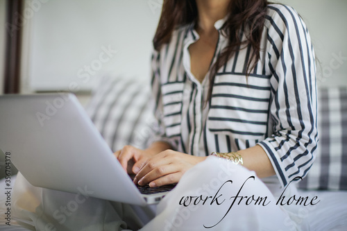 Girl hands working on her laptop from home. Online homeschooling. 