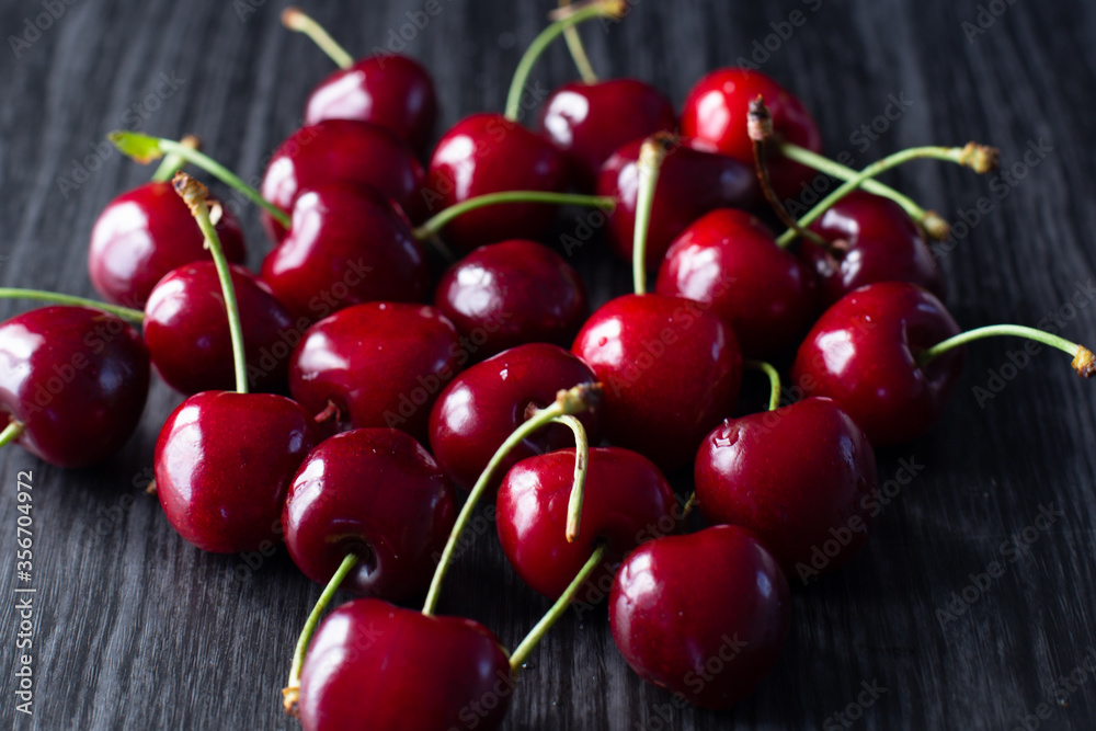 cherries on a black wood background healthy food cherries on a black wood background healthy food