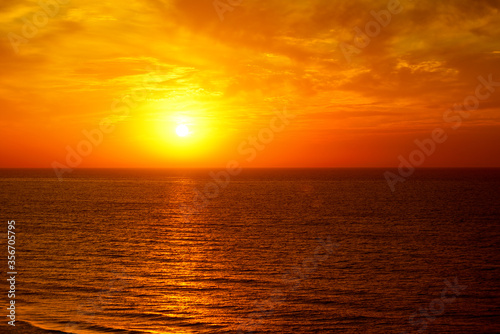 Fantastic ocean and sunset sky in red colors. © Serghei V